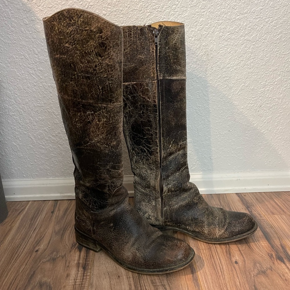 Tall, leather, distressed, zip up boots.